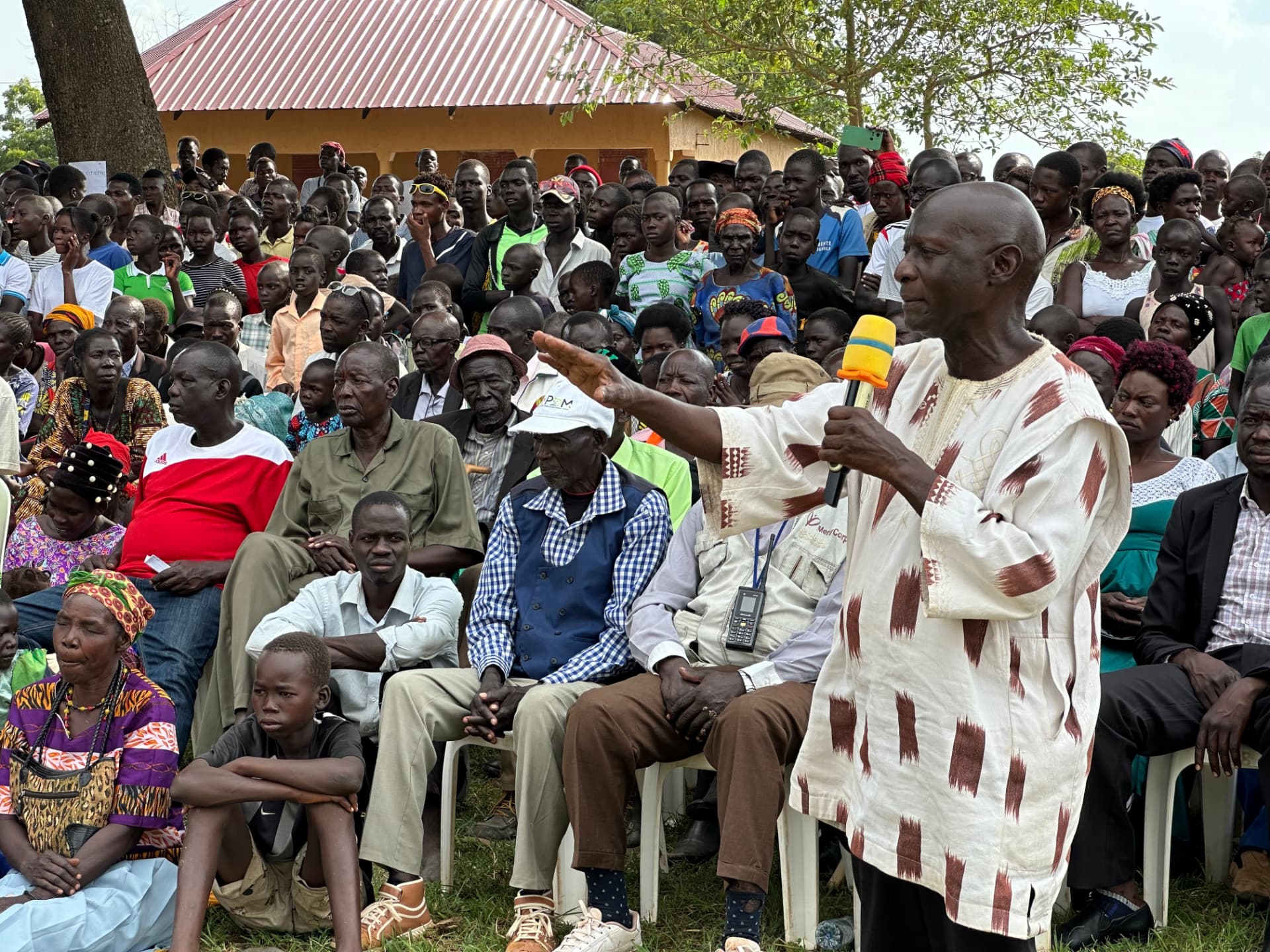 Olara Otunnu addressing a community gathering